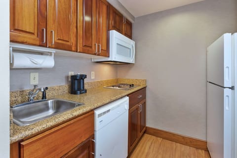 Studio, One King Bed, Non-Smoking | Private kitchen | Full-size fridge, microwave, stovetop, dishwasher