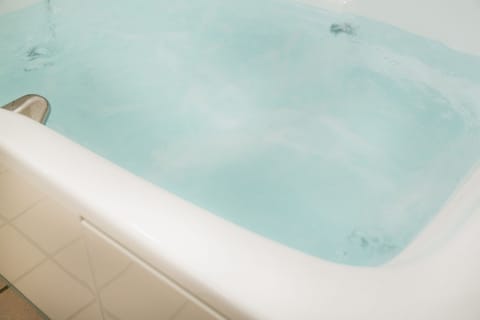 Separate tub and shower, deep soaking tub, hair dryer, bathrobes