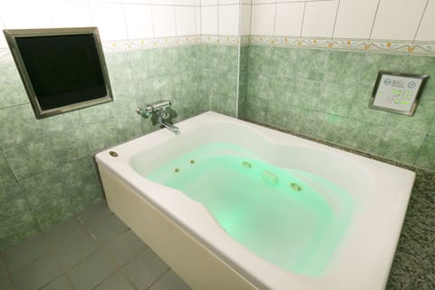 Suite Room | Bathroom | Separate tub and shower, deep soaking tub, hair dryer, bathrobes