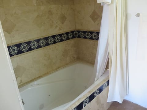 Premium Suite, 1 King Bed, Jetted Tub, Mountain View | Deep soaking bathtub