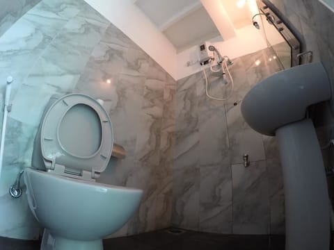 Economy Double Room, 2 Bedrooms (Fan) | Bathroom | Shower, rainfall showerhead, designer toiletries, hair dryer