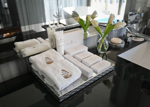 Presidential Suite | Bathroom | Designer toiletries, hair dryer, bathrobes, slippers