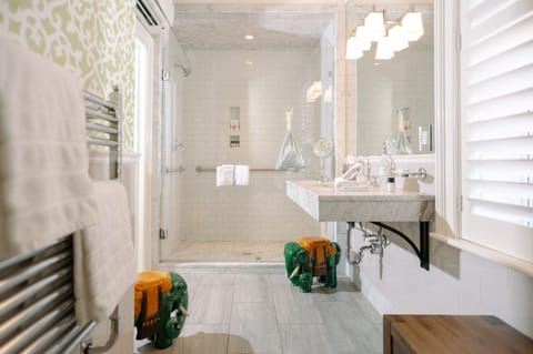 Deluxe Room | Bathroom | Designer toiletries, hair dryer, bathrobes, towels