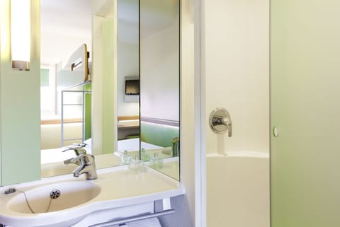 Shower, eco-friendly toiletries, hair dryer, towels