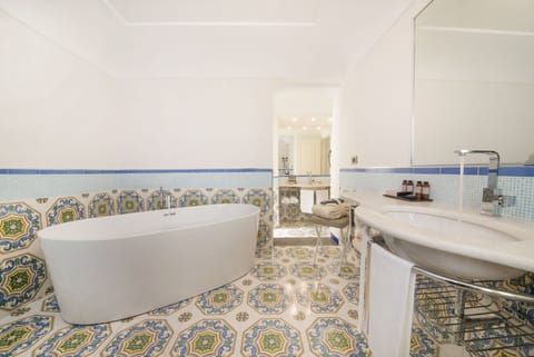 Suite (Amalfi Sunrise) | Bathroom | Rainfall showerhead, designer toiletries, hair dryer, bathrobes