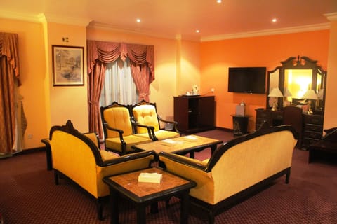 Suite, 1 King Bed | Living area | TV, DVD player