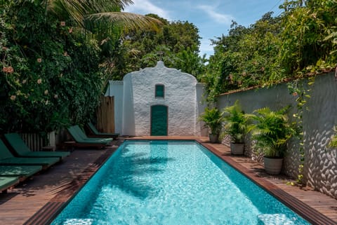 Outdoor pool, a waterfall pool, sun loungers