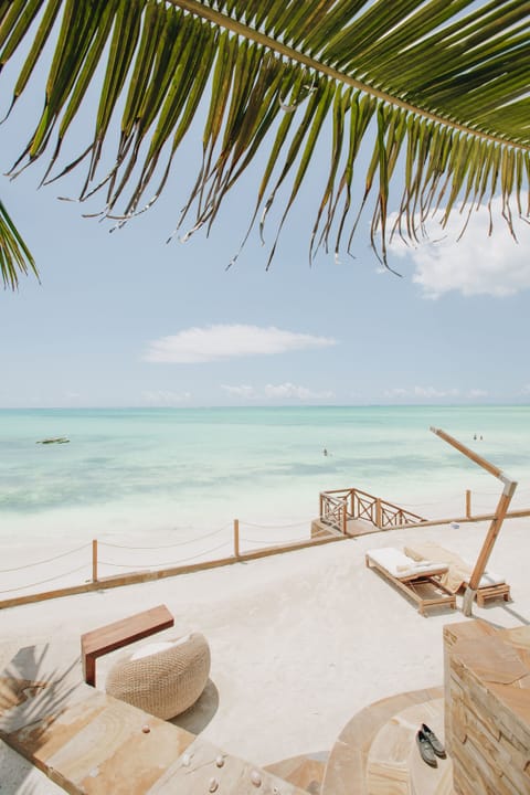 Private beach, white sand, sun loungers, beach umbrellas