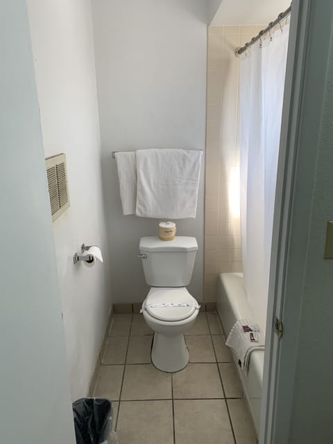 Standard Room, 2 Queen Beds | Bathroom | Combined shower/tub, free toiletries, hair dryer, towels