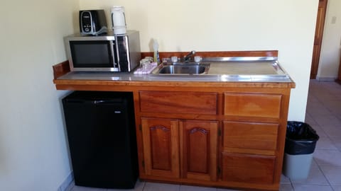 Fridge, microwave, cookware/dishes/utensils