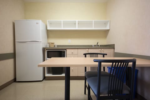 Standard Room, 2 Double Beds | Private kitchen | Fridge, microwave, stovetop, dining tables