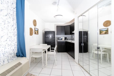 Basic Apartment | Private kitchen | Full-size fridge, microwave, coffee/tea maker, cookware/dishes/utensils