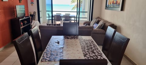 Family Apartment, 3 Bedrooms, Ocean View | Living area | 32-inch flat-screen TV with cable channels, TV, MP3 dock