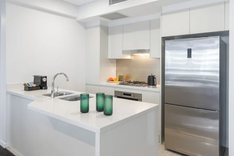 Luxury Suite, 2 Bedrooms | Private kitchen | Full-size fridge, microwave, stovetop, dishwasher