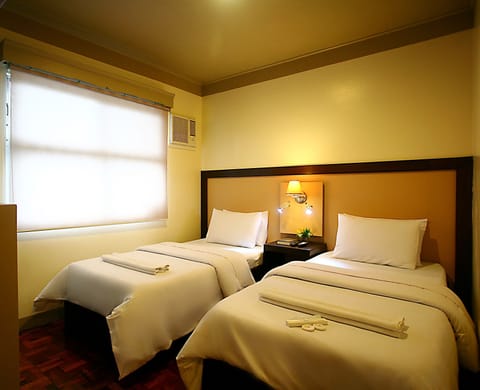 Deluxe Room, Multiple Beds | Minibar, free WiFi, bed sheets