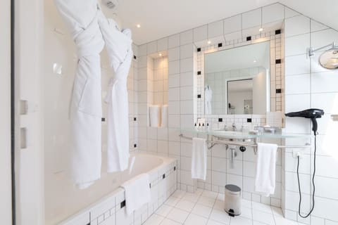 Designer toiletries, hair dryer, bathrobes, slippers