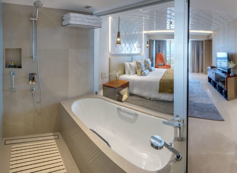 Suite, 1 King Bed, Sea View | Bathroom | Shower, designer toiletries, hair dryer, bathrobes