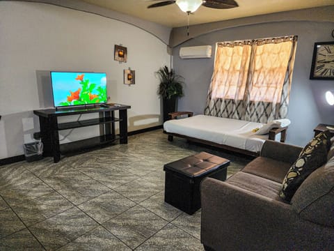 Luxury Room, 1 King Bed, Poolside | Living area | 32-inch flat-screen TV with cable channels, TV