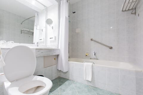 Suite, 1 King Bed, Smoking, City View | Bathroom | Separate tub and shower, deep soaking tub, free toiletries, hair dryer