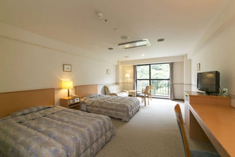 Twin Room, Half board, Non Smoking | In-room safe, desk, iron/ironing board, free WiFi