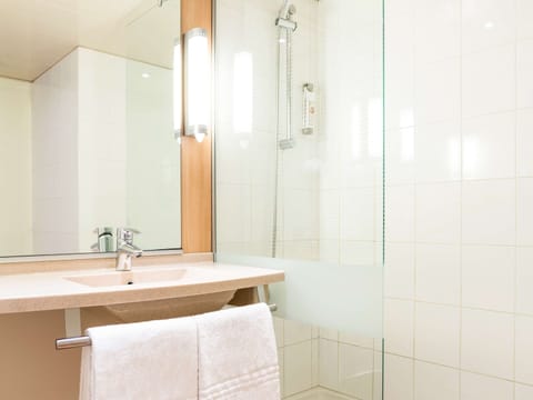 Shower, eco-friendly toiletries, hair dryer, towels