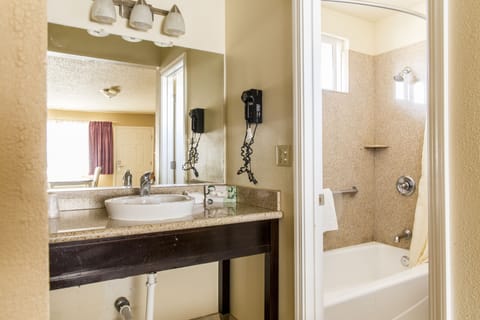 Standard Room, 1 King Bed | Bathroom | Combined shower/tub, hair dryer, towels