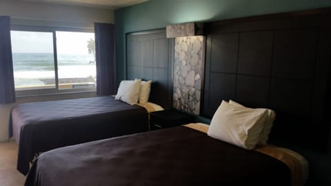 Basic Room, 2 Double Beds, Balcony or Patio, Oceanfront | Individually decorated, individually furnished, desk, free WiFi