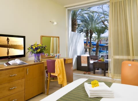 Superior Room, Pool View | Minibar, in-room safe, desk, blackout drapes