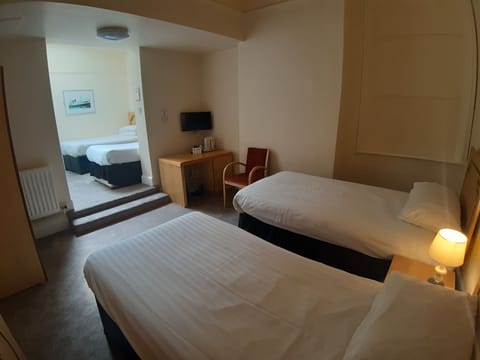 Basic Quadruple Room, Multiple Beds | In-room safe, desk, free WiFi, bed sheets