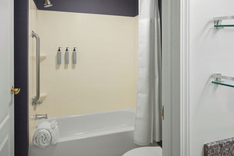 Suite, 1 Bedroom | Bathroom | Combined shower/tub, designer toiletries, hair dryer, towels