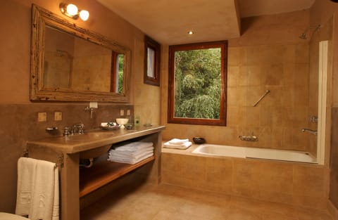 Deluxe Room | Bathroom | Combined shower/tub, deep soaking tub, rainfall showerhead