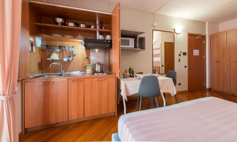 Studio | Private kitchenette | Fridge, highchair