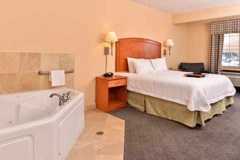 Suite, 1 King Bed, Non Smoking (Jetted Tub) | Premium bedding, pillowtop beds, blackout drapes, iron/ironing board