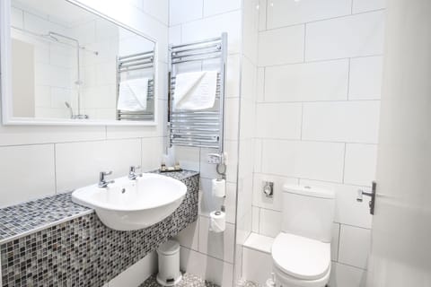 Combined shower/tub, free toiletries, hair dryer, slippers