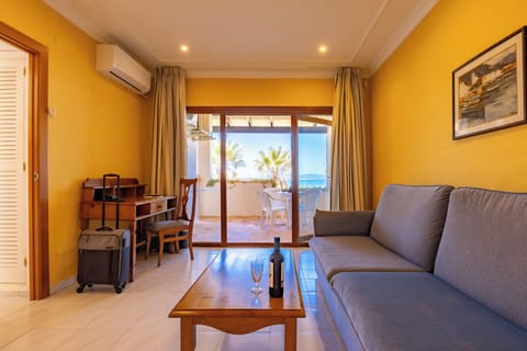 Apartment, 1 Bedroom | Living area | 32-inch flat-screen TV with satellite channels, TV, table tennis