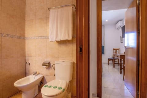 Triple Room, Garden View | Bathroom | Hair dryer, bidet, towels, soap