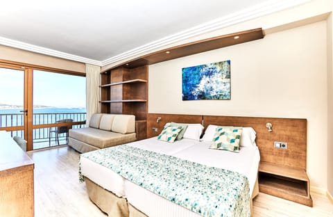 Superior Triple Room, Partial Sea View | Minibar, in-room safe, desk, iron/ironing board