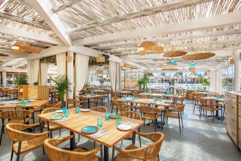 Breakfast, dinner served; international cuisine, pool views