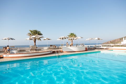 Seasonal outdoor pool, a rooftop pool, pool umbrellas, sun loungers