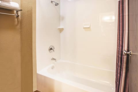 Premium bedding, desk, laptop workspace, blackout drapes