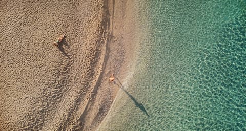 Beach nearby, white sand, beach volleyball