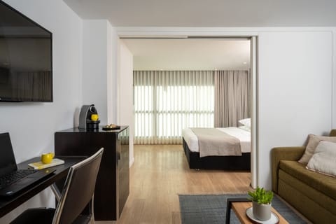 Junior suite | Living area | 42-inch LCD TV with digital channels, TV