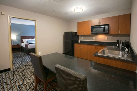 Suite, Multiple Beds, Non Smoking, Kitchenette (with Sofabed) | Desk, laptop workspace, blackout drapes, iron/ironing board