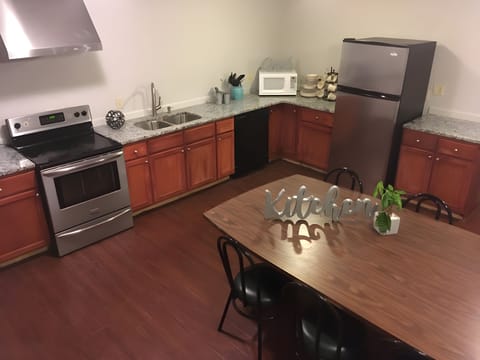 Microwave, coffee/tea maker, dining tables