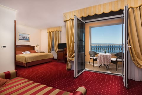 Superior Double Room, Balcony, Sea View | Minibar, in-room safe, desk, laptop workspace