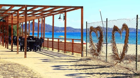 Private beach, white sand, sun loungers, beach umbrellas