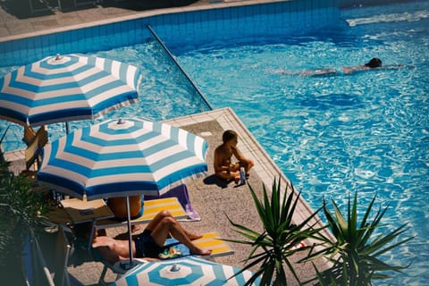 Seasonal outdoor pool, pool umbrellas, sun loungers