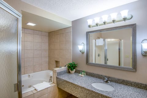 Suite, 1 King Bed | Bathroom | Combined shower/tub, free toiletries, hair dryer, towels