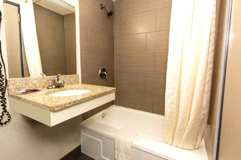 Standard Room, 1 King Bed, Non Smoking, Refrigerator & Microwave | Bathroom | Combined shower/tub, designer toiletries, hair dryer, towels