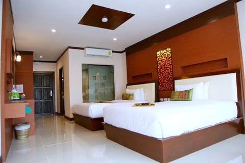 Family Suite, Pool View | Minibar, in-room safe, desk, iron/ironing board